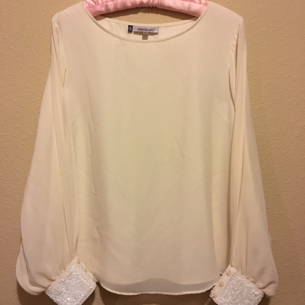 Jennifer Lopez winter white open sleeve blouse